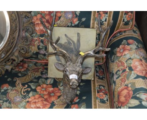 A stags head wall ornament; together with a print depicting a hare
