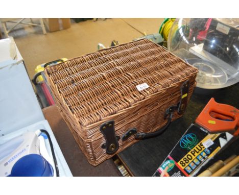 A wicker picnic hamper 