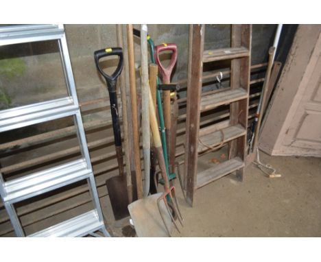 A quantity of long handled gardening tools
