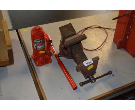 A bench vice together with a Clark 3 tonne bottle jack 