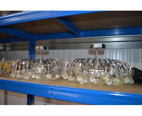 A pair of hanging light fittings