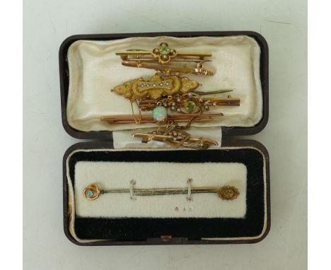 collection of gold brooches &amp; pins: collection of six gold coloured metal brooches, together with 2 stick pins.  Gross we