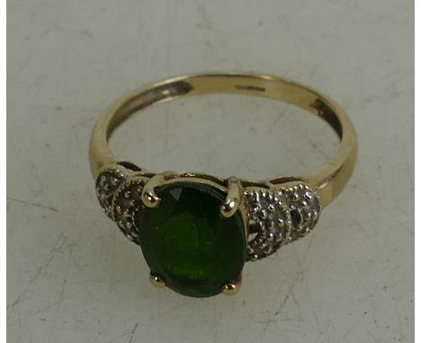 9ct gold ladies dress ring set with green stone,size L,1.9 grams.