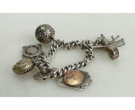 Silver vintage charm bracelet: Silver Albert chain mounted with various silver charms medals etc, 95 grams.