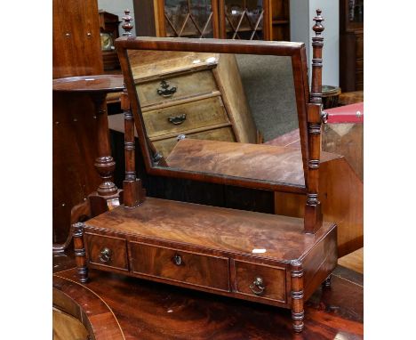 A Regency mahogany dressing table mirror, with ring turned supports and set with three drawers to the base, 55cm by 24cm by 6