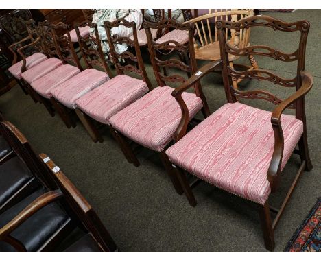 A set of eight 20th century Georgian style mahogany ladder back dining chairs comprising, a pair of carvers and six side chai