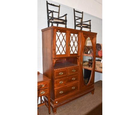 A late Victorian mahogany and satinwood banded combination wardrobe, makers Goodall, Lamb &amp; Heighway Ltd, with bevelled g