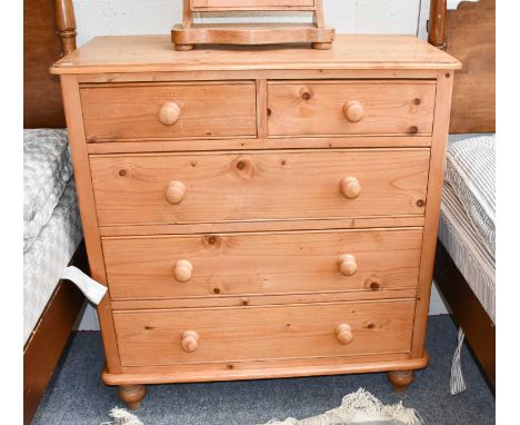 A modern pine four height chest of drawers, 96cm by 46cm by 102cm, together with a pair of matching bedside chests, 56cm by 3
