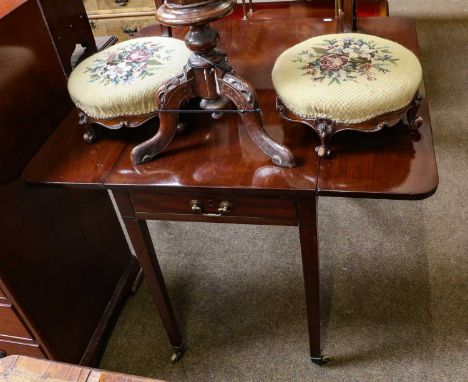 An early 19th century mahogany single drawer Pembroke table, raised on square tapering supports, capped with brass castors, 9