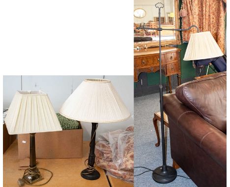 A modern rise and fall matt black metal standard lamp, with carrying loop, and pleated silk shade; together with two metal co