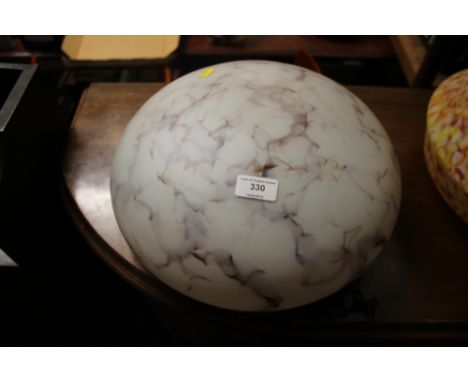 A mottled glass light shade