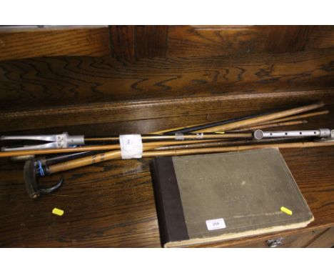 A bundle of walking sticks; a shooting stick and arrows