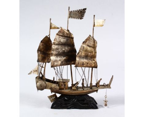 A 19TH CENTURY CHINESE SOLID SILVER MODEL OF A JUNK, the back of the ship with four character chinese calligraphic mark, the 