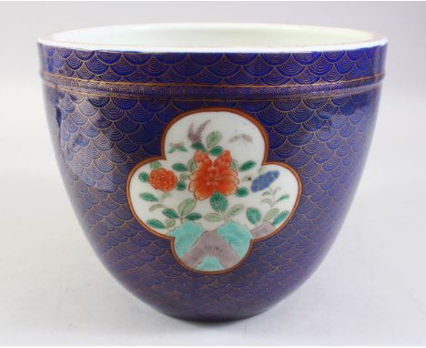 A JAPANESE MEIJI PERIOD POWDER BLUE &amp; GILT DECORATION  PORCELAIN JARDINIERE / POT, with panels of floral display, upon a 
