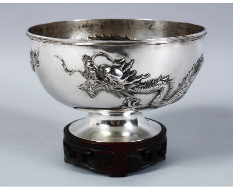 A GOOD 19TH CENTURY CHINESE SOLID SILVER DRAGON BOWL &amp; STAND, the body of the bowl decorated with scenes of a dragon, the