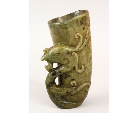 A GOOD CHINESE CARVED JADE /  HARDSTONE LIBATION CUP, carved with phoenix head handle, 13cm high.