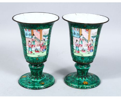 A GOOD PAIR OF 19TH CENTURY CHINESE CANTON ENAMEL GOBLETS, each decorated with two panels upon an apple green ground depictin