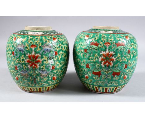 A PAIR OF 19TH CENTURY CHINESE KANGXI STYLE FAMILLE VERTE PORCELAIN JARS, the body of the jars with a green glaze, further de