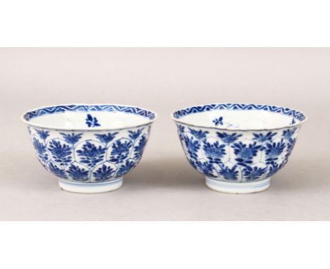 A PAIR OF 18TH CENTURY CHINESE KANGXI BLUE &amp; WHITE PORCELAIN BOWLS, each bowl with moulded honeycombed pattern and decora