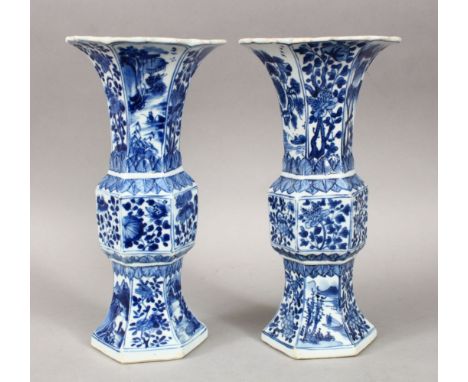 A GOOD PAIR OF 18TH CENTURY CHINESE KANGXI BLUE &amp; WHITE GU SHAPE PORCELAIN VASES, with a multitude of panels depicting fl