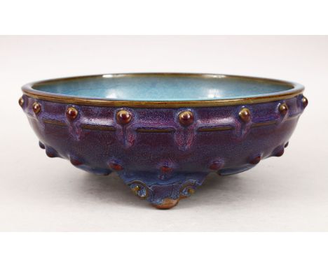 A GOOD CHINESE JUN WARE TRIPOD FOOT CENSER, the body with a robins egg / aubergine flambe style glaze, with moulded stud deco