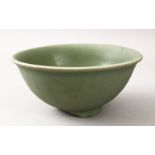 A CHINESE MING DYNASTY CELADON LONGQUAN CELADON STONEWARE BOWL, 20.5cm diameter x 9.5cm high.