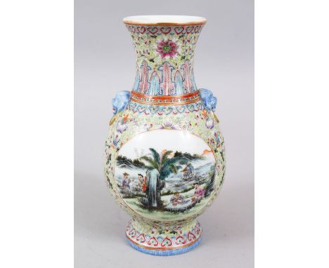 A GOOD CHINESE REPUBLIC PERIOD FAMILLE ROSE PORCELAIN VASE, the vase with twin moulded lion dog head handles, two main panels