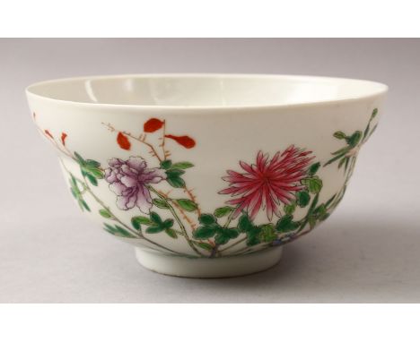 A GOOD CHINESE FAMMILE ROSE PORCELAIN BOWL, decorated with native floral scenes, the base with an iron red six character poss