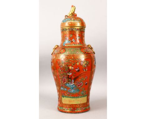 A GOOD 19TH CENTURY CHINESE CORAL RED GROUND FAMILLE ROSE PORCELAIN VASE, the orange ground decorated in canton style with pa