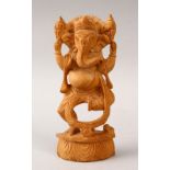 A 20TH CENTURY CARVED WOODEN INDIAN FIGURE OF GANESH, stood upon a carved base, 16cm high