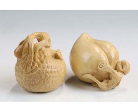 Two carved wooden netsuke figures of fruit