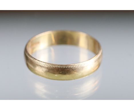 A fully hallmarked 9ct gold wedding band ring.