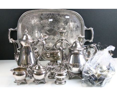 Assortment of silver plate items to include large engraved serving tray, candelabra, footed rose bowls, handled basket, coffe