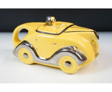 Art Deco ceramic racing car teapot in yellow and chrome, signed D to base
