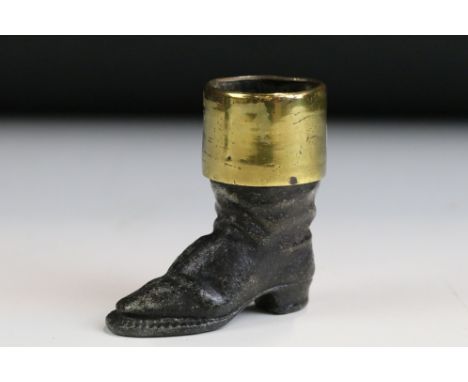 An vintage Spelter and Brass Novelty Match Holder / Striker in the Form of a Boot, approx 6cm in height.