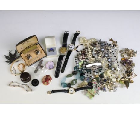 A small collection of mixed vintage and contemporary costume jewellery to include brooches, necklaces, earrings....etc..