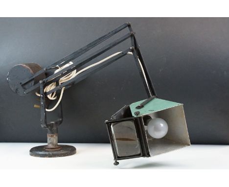 Horstmann Pluslite adjustable counterbalanced lamp on cast iron base with liftable shade and concealed magnifying glass