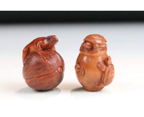 Two signed carved wooden netsuke figures to include Turtles on pot and Frog on fruit
