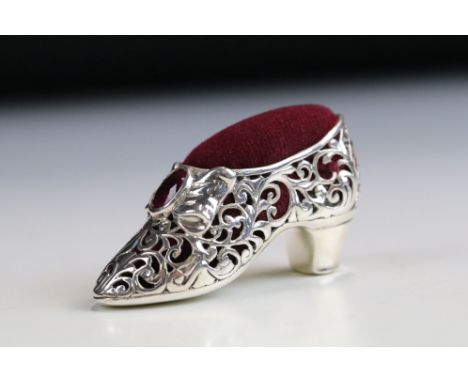 Silver pincushion in the form of a Victorian shoe set with ruby cabochon