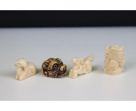 Four carved miniature bone netsuke figures to include signed dragons head and galloping horse