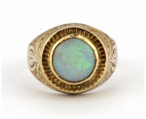 A gentleman's yellow metal (tested high carat gold) signet ring set with an opal doublet, (M).