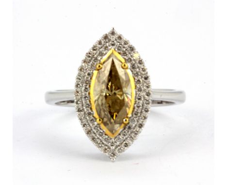 An 18ct white gold (stamped 750) ring set with a 1.27ct marquise cut fancy dark yellow diamond surrounded by brilliant cut di