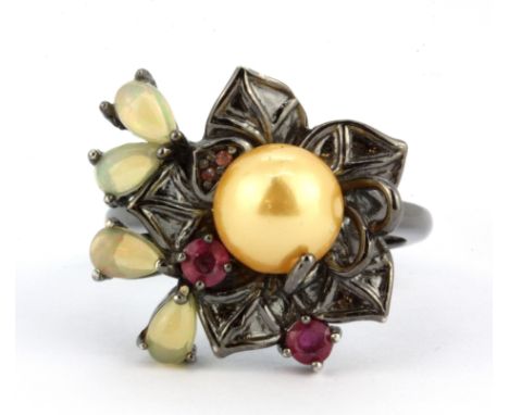 A 925 silver flower shaped ring set with a cream pearl, cabochon cut opals and rubies, (P.5).