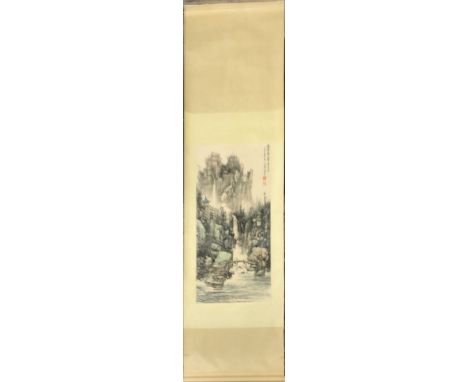 A silk mounted Chinese scroll painting of a mountain landscape, W. 68cm L. 209cm.
