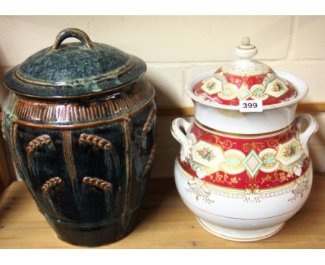 A large 19th century ceramic jar and a later glazed pottery jar, H. 39cm.