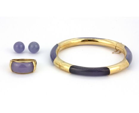 A 14ct yellow gold (stamped 14k) bangle set with lavender jade, together with a 14ct gold lavender jade ring and a similar pa