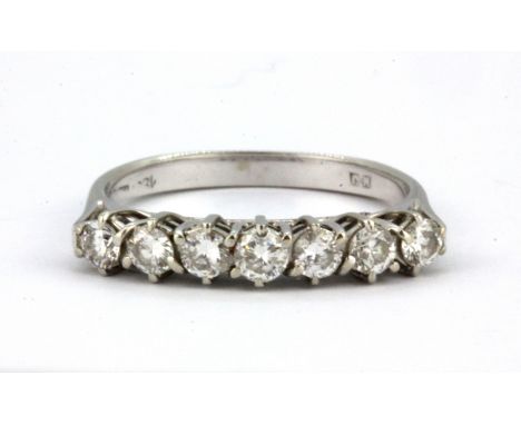 An 18ct white gold ring set with seven brilliant cut diamonds, approx. 0.7ct overall, (M.5).