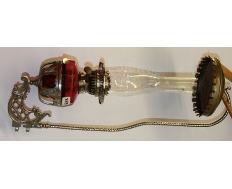 An unusual 19th Century cranberry glass and chromium plated circus/ fair ground wagon lamp and bracket, H. 62cm.