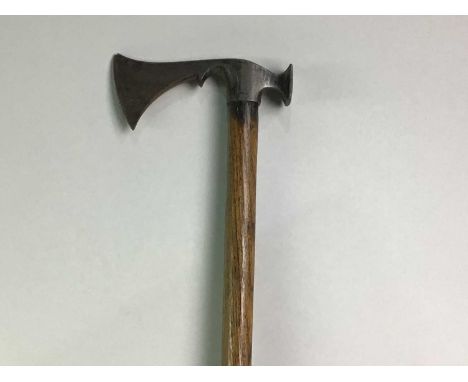 POLE AXE 19TH CENTURY possibly Eastern European, the head with curved blade and hammer pick83cm long