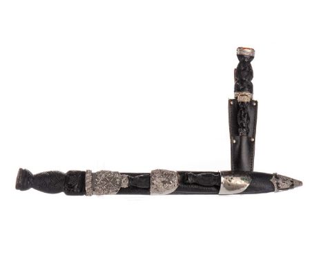 HIGHLAND DIRK, EARLY TO MD-20TH CENTURY with chromed fullered and serated blade over a basket weave grip, the scabbard fitted